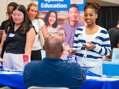 Students speak with recruiter at Job Fair