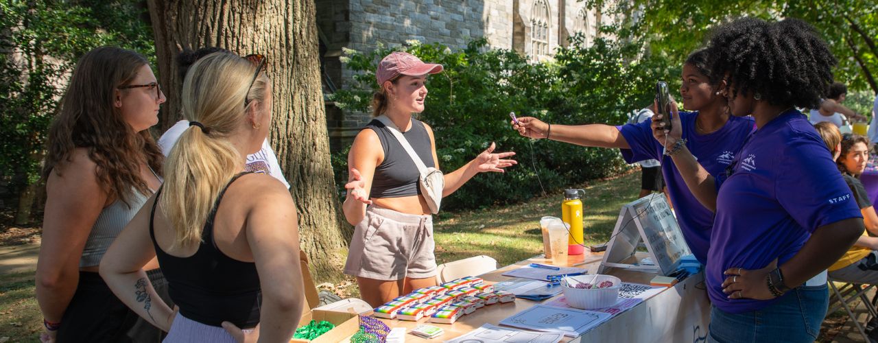 students at org fair being interviewed