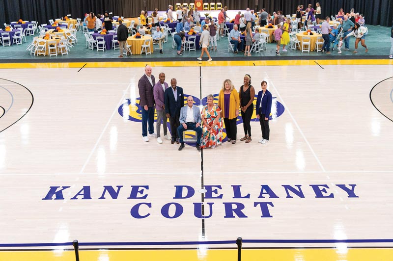 Pictured (L-R) at the Kane DeLaney Court ceremony are Terry Beattie, director of athletics; Damien Blair, head coach, men’s basketball; Dr. Zebulun Davenport, vice president for University advancement and external affairs; Dick DeLaney, former men’s basketball coach and honoree; Deirdre Kane, former women’s basketball coach and honoree; Dr. Laurie Bernotsky, president, West Chester University; Kiera Wooden, head coach, women’s basketball; Deb Cornelius, executive director, WCU Foundation.