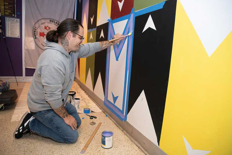 Ben Miller at the mural in Sykes