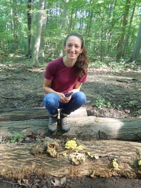 GNA Intern Ariana Rivellini posing with some Golden Oyster mushrooms (Pleurotus citrinopileatus)