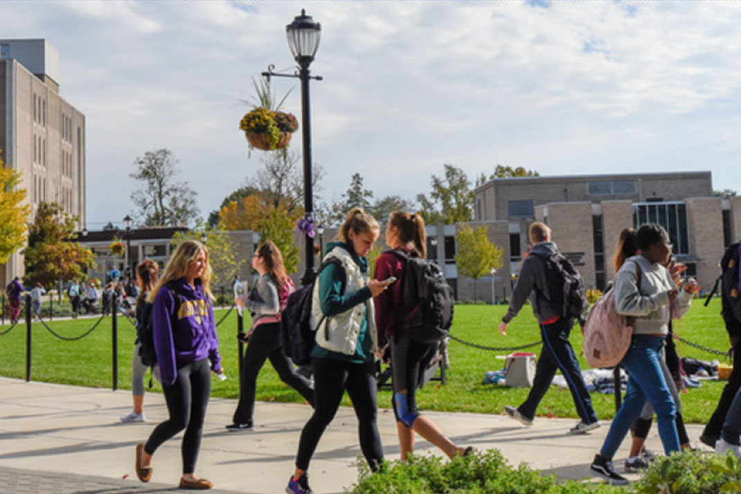 View of the campus quad with students walking around