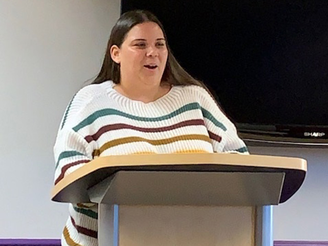 woman standing at podium