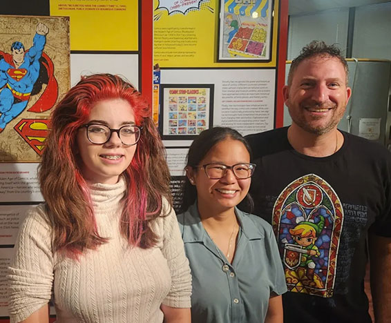 3 patrons infront of the exhibit