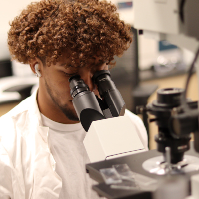 Student with microscope